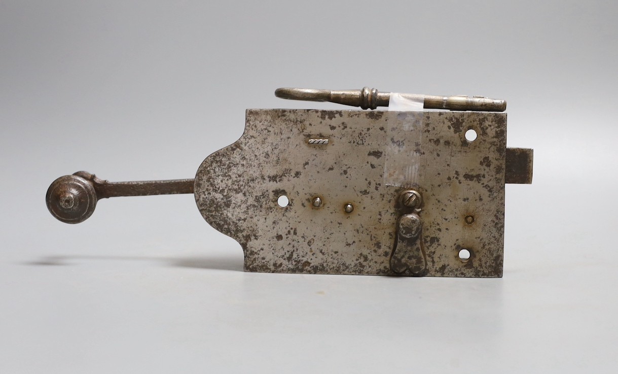 A 17th/18th century steel lock with working mechanism and original key, body 17cm